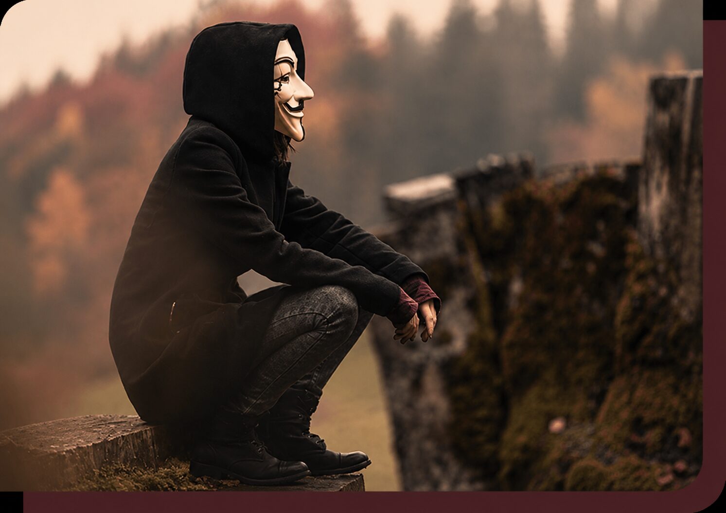 A hooded figure in a white mask, the false self of the narcissist